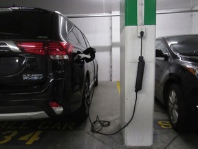An electric vehicle charging in an underground parking lot in Vancouver.