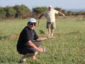 Tony Aronson (left) fools around with his late father, Mayer Aronson, in February 2012 during a trip to South Africa's Kruger National Park, one of Africa's largest game reserves. [PNG Merlin Archive]