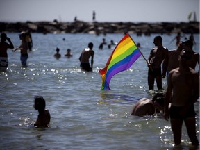 Israelis participate in the annual Gay Pride parade at Tel Aviv's beach on June 8, 2012.