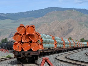 Steel pipe to be used in the construction of the Trans Mountain pipeline sit on rail cars at a stockpile site in Kamloops, B.C.