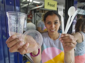 Mariel Palacios holds compostable utensils and containers at the Popina Canteen on Granville Island.