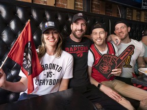 Raptor fans (from left) Krista Francescut, Christian Beckermann, Trevor Kennedy and Jesse Michek get ready for the Raptors game at Red Card Sports Bar in Vancouver, BC, June, 2, 2019.