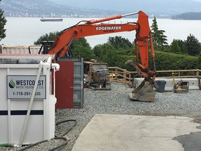 Construction crews are working on the home at 4749 Belmont Ave., which is not visible from the street. The owner is suing the city for applying the empty homes tax on the property even as she waited on the city for permits to do a reconstruction.