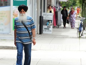 Pedestrians on Main Street in Vancouver on June 27. Vancouver city council unanimously passed a motion this month seeking to revitalize the Punjabi Market.