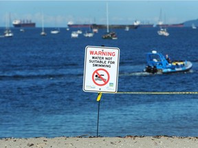 Warning signs were put up on Sunset Beach on Saturday, June 29, following the announcement by the Vancouver Park Board  that the beach has been closed to swimmers after Vancouver Coastal Health tested high E. coli levels in the water.