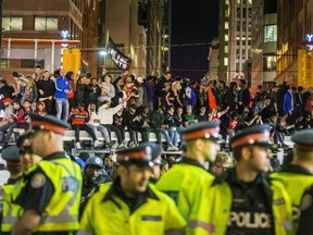 Fans fill the streets of downtown Toronto celebrating the Raptors victory over the Golden State Warriors in the NBA Finals on Friday June 14, 2019.