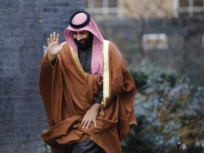 In this file photo taken on March 7, 2018 Saudi Arabia's Crown Prince Mohammed bin Salman waving as he arrives for talks at 10 Downing Street, in central London.