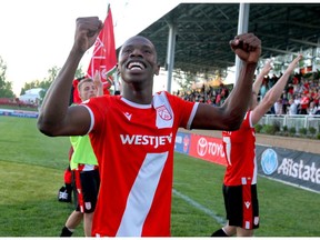 Cavalry FC's Elijah Adekugbe celebrates post game after CPL Action between the Hamilton Forge FC and Cavalry FC in Calgary at ATCO Field at Spruce Meadows on Tuesday. Cavalry won 2-1. Photo by Jim Wells/Postmedia.