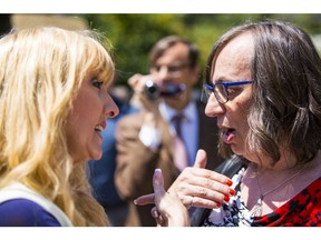 PPC candidate Laura Lynn Tyler Thompson (left) and human rights activist Morgane Oger (right) argue at an anti-SOGI rally held at the Vancouver Art Gallery.