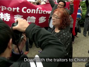 After a request for support from the local consul general of China, Chinese-Canadian backers of the Confucius Institute rally outside the Toronto school board offices in 2014.