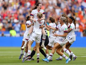 Rose Lavelle of the USA celebrates with Emily Sonnett of the USA and teammates at full-time after winning the 2019 FIFA Women's World Cup France Final match between The United States of America and The Netherlands on Sunday.