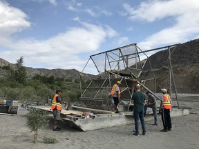 A fish wheel is assembled on the banks of the Fraser River near the Big Bar slide site.