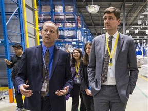 B.C. Attorney General David Eby, right, tours the new liquor distribution warehouse  in Delta with B.C. LDB CEO Blain Lawson last year.