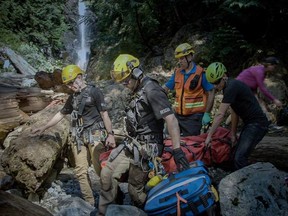 Eight calls were received by three different search and rescue crews across the Greater Vancouver area over the course of the weekend, including North Shore Rescue (pictured) who rescued a male hiker who had slid on a snowy slope and suffered a head injury and broken wrist on Sunday.