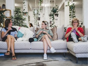 Sarah Beaudoin, founder of Gibou, (at centre) sits with knitters for her brand Gibou.