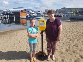Karen Wells, with her granddaughter Aleighna, 7, shows off one of the sunscreen stations she is trying to bring to various public places in Kelowna, including the Kelowna Golf and Country Club, the Kelowna Visitor Centre and Gyro Beach, this summer.