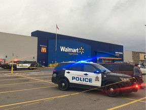 Police are seen in the parking lot of the Capilano Walmart in Edmonton on Saturday, July 14, 2019 after reports of a shooting.