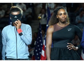 U.S. Open Womens Single champion Naomi Osaka of Japan (L) with Serena Williams of the US during their Women's Singles Finals match at the 2018 US Open at the USTA Billie Jean King National Tennis Center in New York on September 8, 2018.