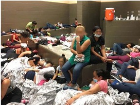 This image released in a report on July 2, 2019 by the US Department of Homeland Security (DHS) Inspector General Office (OIG) shows migrant families overcrowding a Border Patrol facility on June 11, 2019 in Weslaco, texas.