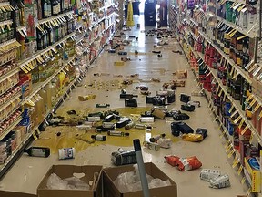 This handout picture obtained courtesy of Rex Emerson taken on July 4, 2019 shows broken bottles and other goods in a store in Lake Isabella, California after a 6.4 magnitude quake hit Southern California.