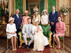 Britain's Prince Harry, Duke of Sussex (centre left), and his wife Meghan, Duchess of Sussex holding their baby son, Archie Harrison Mountbatten-Windsor flanked by (left to right) Britain's Camilla, Duchess of Cornwall, Britain's Prince Charles, Prince of Wales, Ms. Doria Ragland, Lady Jane Fellowes, Lady Sarah McCorquodale, Britain's Prince William, Duke of Cambridge, and Britain's Catherine, Duchess of Cambridge in the Green Drawing Room at Windsor Castle.