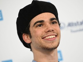 In this file photo taken on April 25, actor Cameron Boyce arrives for WE Day California. Boyce, age 20, died July 6, 2019 from a seizure due to an ongoing medical condition. The Disney Channel confirmed his death to CNN on Sunday morning.