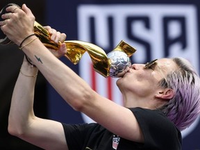 USA women's soccer player Megan Rapinoe kisses the trophy in front of the City Hall after the ticker tape parade for the women's World Cup champions on July 10, 2019 in New York.