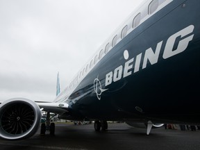 The Boeing Co. logo sits on the side of a 737 Max aircraft during preparations ahead of the Farnborough International Airshow 2016.