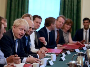 Prime Minister Boris Johnson holds his first Cabinet meeting at Downing Street in London, Britain, July 25, 2019 .