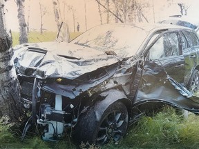 The crashed car of 60-year-old Horst Stewin who was shot in the left side of the head by someone in a passing car is shown in this undated court handout photo. There was conflicting testimony in court Monday about whether a youth charged in the shooting of a German tourist on an Alberta highway may have acted on his own or was ordered to fire the gun.