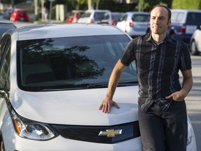 Neil MacEachern of Plug In B.C. with his personal electric vehicle.