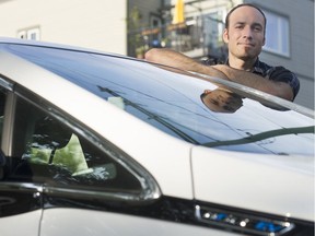 Neil MacEachern of Plug in B.C. with his personal electric vehicle, in Vancouver on July 3.