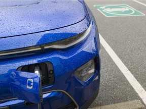 A 2020 Kai Soul EV charges at one of three EV charging stations by the Hillcrest Aquatic Centre in Vancouver.