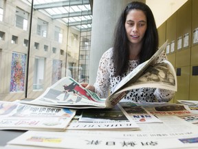 Blythe Irwin, who monitors the ethnic language media across Canada, with a selection of papers.