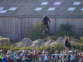 Franky Zapata stands on his jet-powered "flyboard" as he takes off from Sangatte, northern France, attempting to fly across the 35-kilometre (22-mile) Channel crossing in 20 minutes, while keeping an average speed of 140 kilometres an hour (87 mph) at a height of 15-20 metres (50-65 feet) above the sea on July 25, 2019.