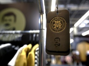 A brand label for clothing by "El Chapo 701," a line in clothing bearing the nickname of the jailed Mexican drug lord Joaquin "El Chapo" Guzman Loera, hangs at a stand during the 71 edition of IM Intermoda Mexico fashion fair in Guadalajara, Mexico, on July 16, 2019.