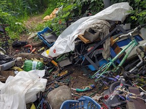Part of a large pile of garbage discovered adjacent to Kanaka Creek in Maple Ridge. The debris was found by a family who led a volunteer effort to clean up the area.