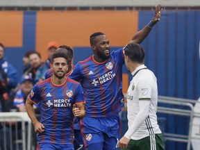 DDdefender Kendall Waston, centre, celebrates after scoring in the first half of an MLS match against the Portland Timbers, Sunday on March 17, 2019, in Cincinnati.