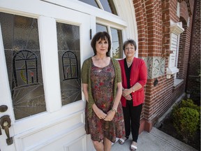 Andrea Sievers, left, and Laurie Smith where their father was abandoned in front of an orphanage at birth in Victoria. Photo: Darren Stone/Times Colonist