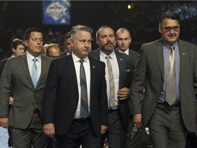 Veteran Canucks scout Dan Palango, second from left, is among a trio of scouts who are no longer with the team as of this week.