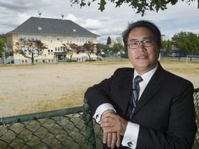 Vancouver school trustee Allan Wong outside Sir Guy Carleton Elementary school.