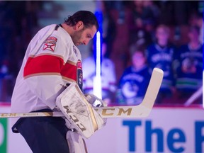 Roberto Luongo on the ice during the national anthems.