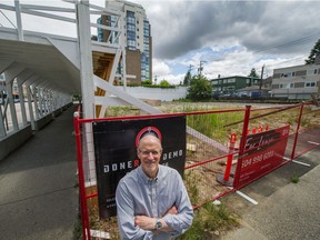 Ian Crook stands beside property at West Broadway and Birch streets in Vancouver on July 2. There is a proposal to build a 28-storey rental building on this site of the former Denny's location.