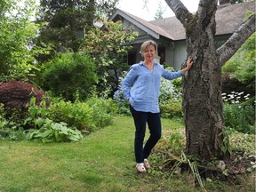Heritage advocate Caroline Adderson, in front of her character home in Kerrisdale in Vancouver.