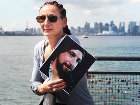 Sia Kaskas, whose late brother Saki Kaskas rose to prominence writing scores for EA's Need for Speed franchise before an accidental overdose of fentayl took his life, holds up his picture in North Vancouver. Sia has decided to share his story to help other families.