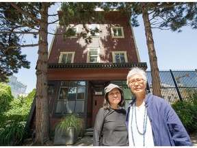 Maryka Omatsu (left) and Judy Hanazawa in front of 313 Alexander street in the old Japan Town in Vancouver.