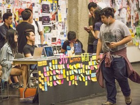 Wednesday’s temporary Lennon Wall at Simon Fraser University, staffed by students.