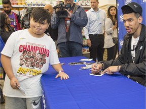Raptors basketball star Danny Green interacts with basketball fans Friday at the Dunbar London Drugs in Vancouver. Green is in town for a weekend basketball camp for kids.