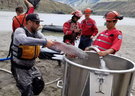 Crews move salmon to a bucket for hoisting by helicopter over the five-metre waterfall in the Fraser River created by the Big Bar slide. 