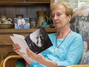Helen Forewell looks through a booklet of photos of her husband Vincent who died in December. Helen struggled to find adequate and timely help for her husband who had dementia.